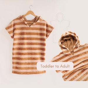 May include: A hooded towel poncho featuring horizontal stripes in shades of tan and cream. The garment is displayed on a wooden hanger and also shown folded, with a line drawing illustration and the text "Toddler to Adult" visible.