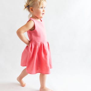 Side of kids dress with snap closure, sewn from digital sewing pattern