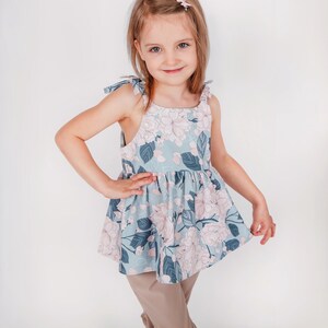 Handmade kids outfit created with a dress and top sewing pattern bundle.