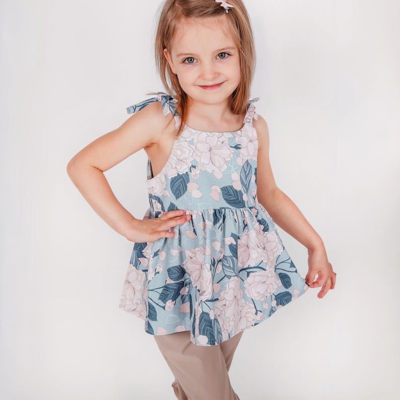 Handmade kids outfit created with a dress and top sewing pattern bundle.