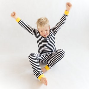 Boy wearing cute pajamas made with simple sewing pattern