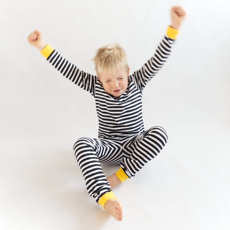 Boy wearing cute pajamas made with simple sewing pattern