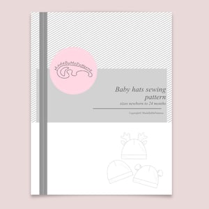 May include: A sewing pattern document for baby hats in sizes newborn to 24 months. The cover features a pink circular logo with the text MadeByMePatterns, a gray stripe, and line drawings of three different baby hat styles.