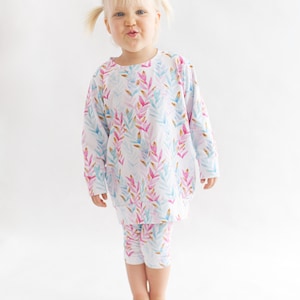 Girl wearing capri leggings sewn from easy PDF pattern ideal for beginner  project
