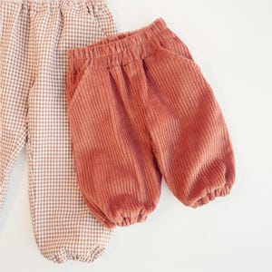 DIY kids clothing project showing loose fit pants for toddlers and babies.