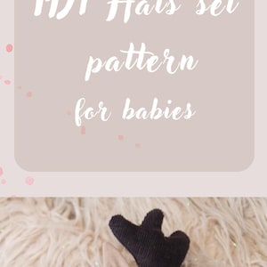 May include: A set of three baby hats including one solid beige hat with black antlers, one beige hat with a brown bear print and ears, and one plain beige hat. The text "PDF Hats set pattern for babies" is displayed in white script.