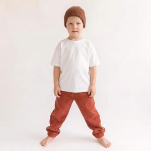 Boys loose fit pants sewn from a PDF sewing pattern in corduroy fabric.
