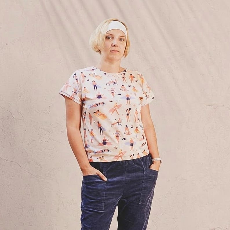 Woman wearing handmade summer T-shirt sewn from a beginner PDF sewing pattern.