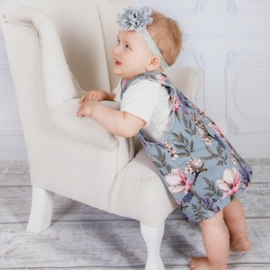 Beginner sewing project showing a simple pinafore dress for kids.