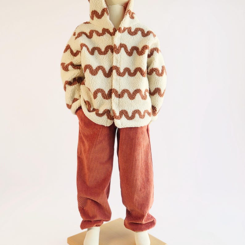 Gender neutral baby pants sewn using a beginner-friendly sewing tutorial.
