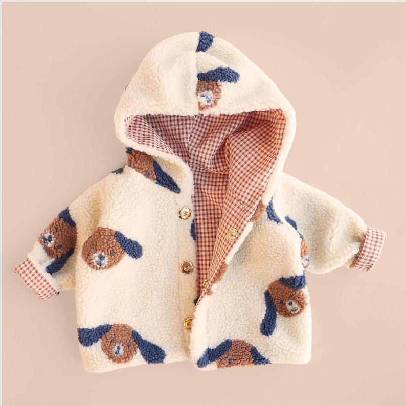 Baby hooded jacket sewn from soft fabric, beginner kids sewing pattern example.