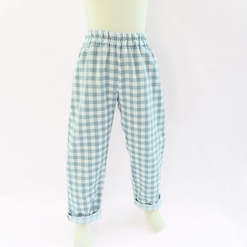 May include: A set of three ceramic mugs with a speckled, matte finish. The mugs are in shades of cream, light gray, and dark gray. Each mug has a simple, minimalist design, perfect for coffee or tea.