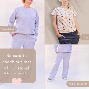 May include: A light grey sweatshirt and matching wide-leg trousers set. The top is a crew neck style. The second image shows a patterned top with dark blue trousers. The text in the image says "Be sure to check out rest of our store! Links in the description."