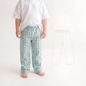 Könnte beinhalten: Ein Kind trägt eine hellgrüne und weiße karierte Hose mit elastischem Bund und einem weißen T-Shirt. Die Hose hat eine lockere Passform. Eine Strichzeichnung der Hose befindet sich neben dem Kind.
