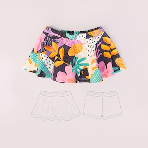 Puede incluir: Una falda pantalón con fondo oscuro y un estampado tropical vibrante de hojas y flores rosas, naranjas, amarillas y turquesas. La prenda incluye una falda acampanada superpuesta y una cintura elástica. Abajo, un dibujo lineal muestra el frente y la parte posterior.