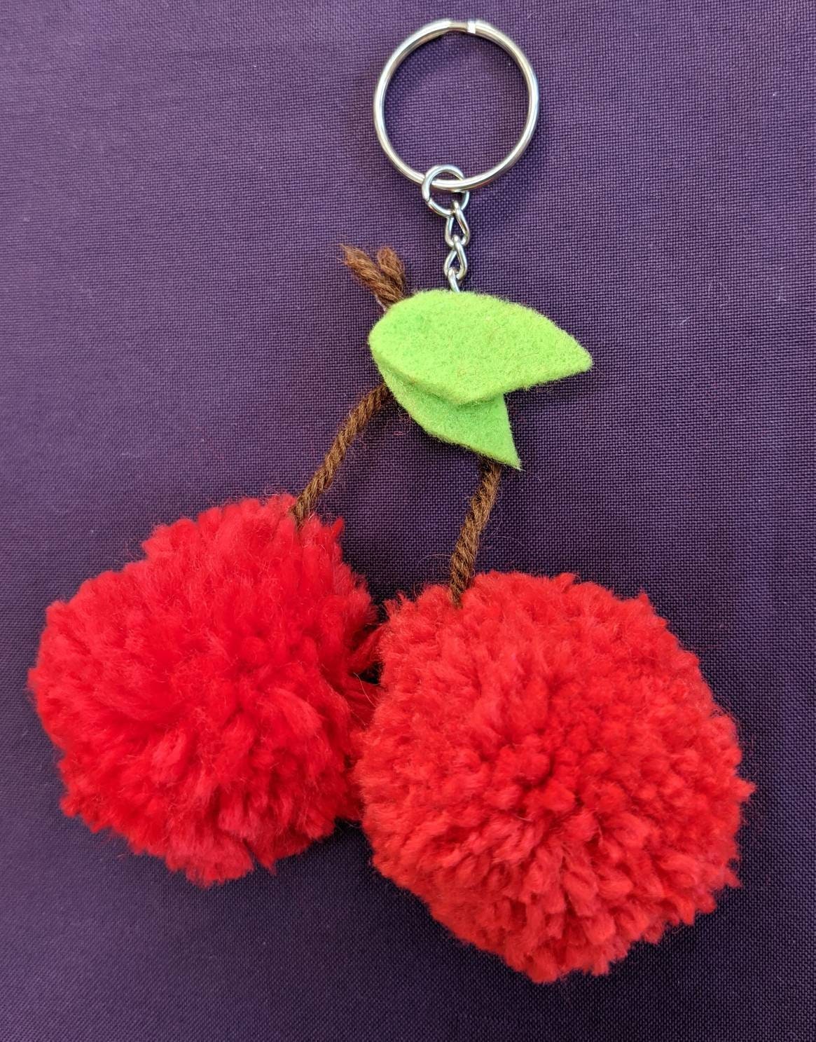 Keyring cherry pom poms