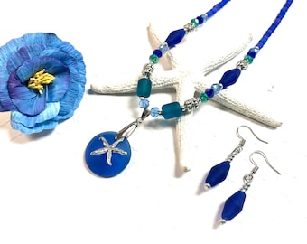May include: A blue glass sea glass necklace with a starfish pendant and matching earrings. The necklace features blue and green glass beads and silver accents.