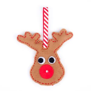 May include: A brown felt reindeer ornament with red and white striped ribbon for hanging. The reindeer has a red felt nose with a sparkly jewel, and black felt eyes.
