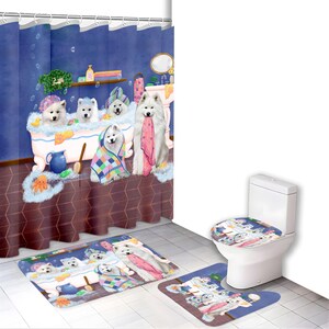 May include: A bathroom set featuring a whimsical illustration of Samoyed dogs in a bathtub. The set includes a shower curtain, bath mat, and toilet seat cover. The dogs are depicted with towels and bath accessories, all in a blue and white color scheme.