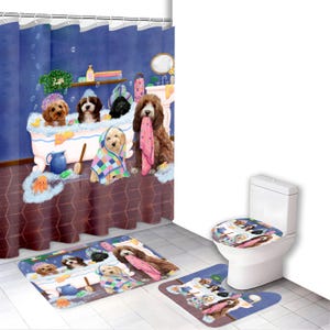 May include: A bathroom set featuring a shower curtain, bath mat, and toilet seat cover with a whimsical illustration of dogs in a bathtub. The set includes a blue shower curtain, a bath mat, and a toilet seat cover.