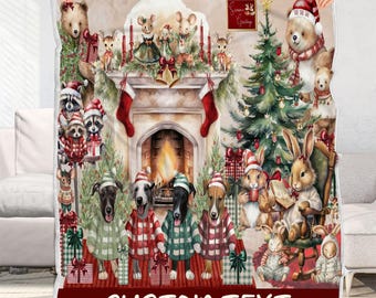 May include: A rectangular fleece blanket featuring a festive Christmas scene with a fireplace, a decorated tree, and various animals including dogs, bears, and rabbits wearing holiday attire. The bottom section contains the text CUSTOM TEXT.