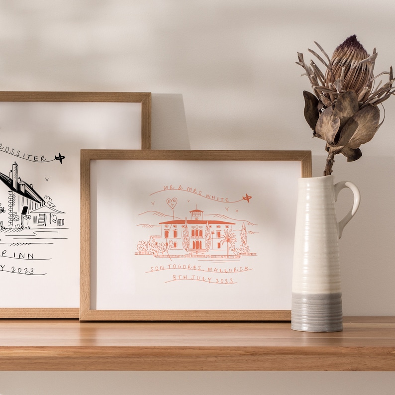 May include: A framed illustration of a house with the text "Mr. & Mrs. White" above it. The text "Son Togores, Mallorca 8th July 2023" is below the house.