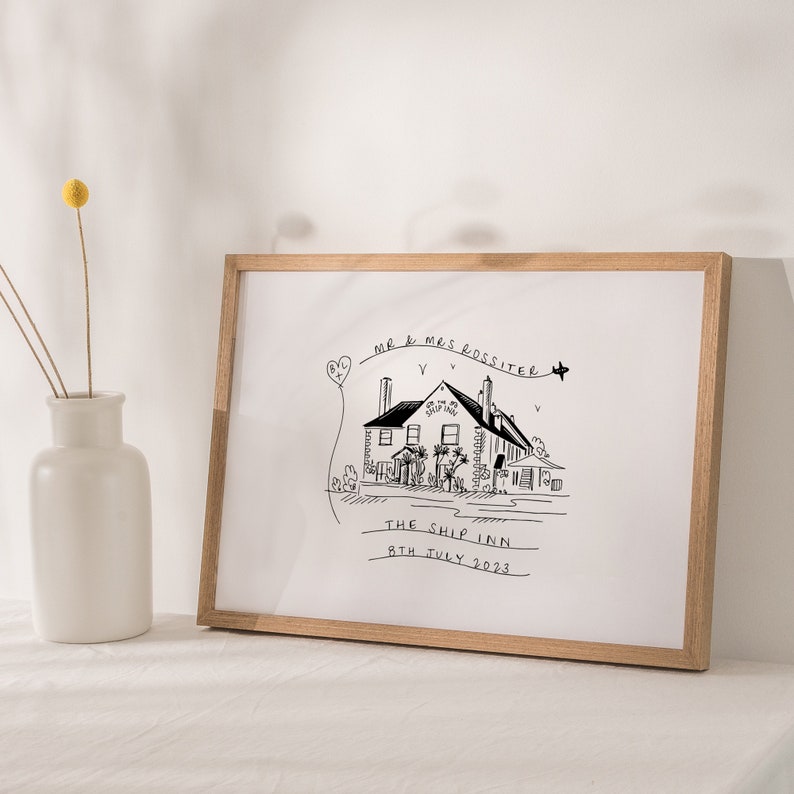 May include: A black and white illustration of a building with the text "MR & MRS ROSSITER THE SHIP INN 8TH JULY 2023" printed below. The illustration is framed in a light brown frame.