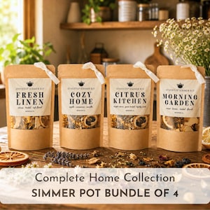 May include: Four brown paper pouches labeled Stovetop Simmer Kit with white ribbon ties. The labels read Fresh Linen, Cozy Home, Citrus Kitchen, and Morning Garden. Each pouch contains dried fruit, spices, and herbs visible through a clear window.
