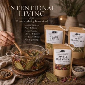 May include: A glass pot filled with water and dried botanicals, stirred with a wooden spoon, alongside three kraft paper pouches labeled Stovetop Simmer Kit with the text Love & Harmony, Peace & Calm, and New Beginnings, plus small bowls of herbs.