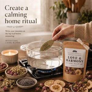 May include: A stovetop simmer kit labeled Love & Harmony with dried flowers and fruit, a glass pot of water on a burner, a bay leaf with the words peace, grace, gratitude, and a candle. Text reads: Create a calming home ritual.