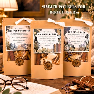 May include: Three kraft paper pouches containing botanical simmer kits labeled Blend I The Opening Chapter, Blend II By Lamplight, and Blend III The Final Page. Each pouch features a white ribbon tie and a circular gold wax seal with a botanical design.