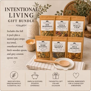 May include: An Intentional Living Gift Bundle featuring six kraft paper pouches of stovetop simmer kits labeled New Beginnings, Love & Harmony, Peace & Calm, Home Blessing, Cleanse & Protect, and Joy & Abundance, with a wooden spoon and spoon rest.