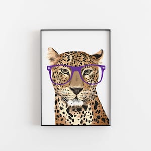 May include: A leopard wearing a pair of purple glasses. The leopard is looking directly at the viewer.