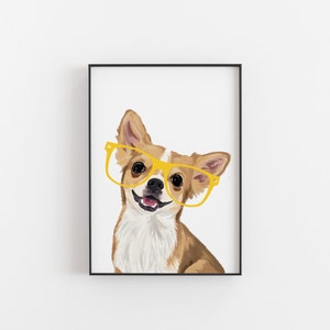 May include: Framed print of a Chihuahua wearing yellow spectacles, smiling. The dog has brown and white fur, with its tongue showing. The artwork is set against a white background, framed in black.