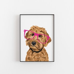 May include: A brown and white dog wearing pink glasses. The dog is looking at the camera. The background is white.