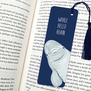 May include: A blue bookmark featuring a white whale illustration and the text "Whale Hello Again".