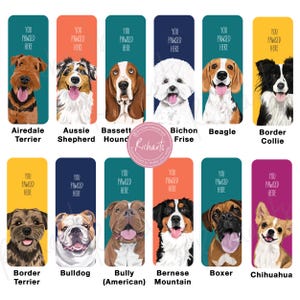 May include: A set of 12 colorful bookmarks featuring different dog breeds. Each bookmark has a cartoon illustration of a dog with its breed name below. The text "You Pawsed Here" is at the top of each bookmark.