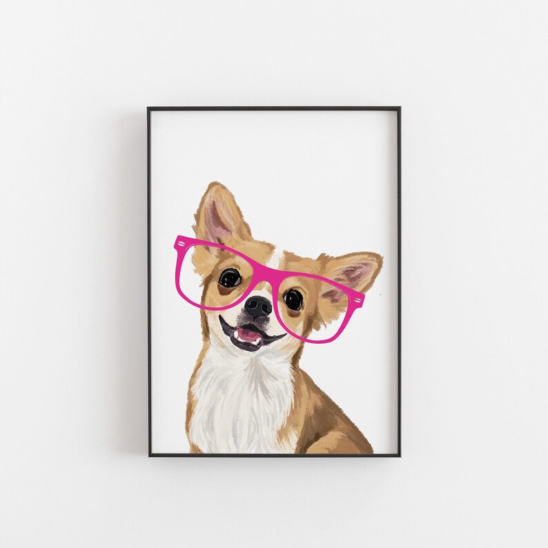 May include: Framed print of a Chihuahua wearing pink glasses, set against a white background. The dog has brown and white fur and is smiling. The artwork is enclosed in a black frame.