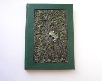 The dark green notebook with dragon is completely handmade