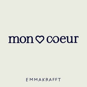 May include: A graphic design with the text "mon coeur" in a dark blue font with a heart symbol and an infinity symbol. The text "EMMA KRAFFT" is below the graphic in a smaller font.