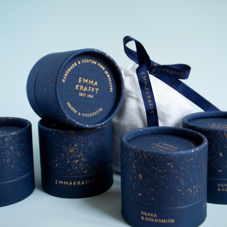 a set of four blue boxes with a blue ribbon