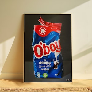Puede incluir: Un paquete de polvo de chocolate azul y rojo arrugado con el nombre de la marca "O'boy" en letras rojas. El paquete tiene el texto "The Original Great Taste Since 1960" y "450g" impreso en él.