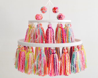 Yarn tassel and pompom mobile, in bright rainbow colors, for home decor and party decoration!