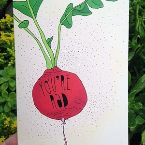 May include: A white card with a red radish illustration and the text "You're Rad" in black.