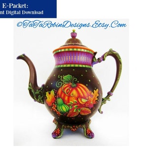 May include: A brown teapot with a purple and orange lid and a painted design of pumpkins, gourds, and leaves. The teapot has a decorative handle and three feet.