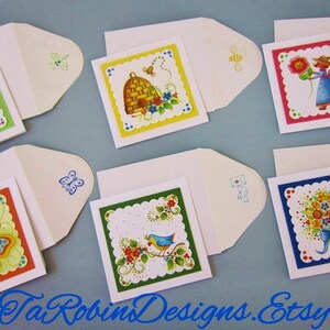 May include: Set of six blank greeting cards with colorful floral and nature-themed illustrations. Each card has a scalloped border and comes with a white envelope. The illustrations include a beehive, a butterfly, a bird, a bouquet of flowers, a girl with a flower, and a flower with a bee.