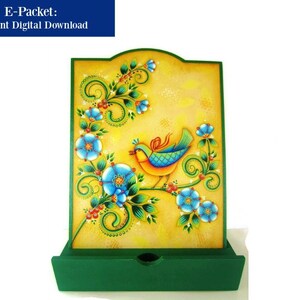 May include: A wooden box with a green drawer and a yellow front panel featuring a painted bird and floral design. The bird is blue, yellow, and green, and the flowers are blue and white.