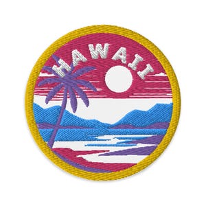 May include: Embroidered patch with a yellow border, depicting a palm tree, a sun, and mountains in a blue and purple landscape. The text "HAWAII" is stitched in white around the sun.