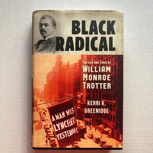 May include: A book cover with a red, white and black colour scheme. The title is "Black Radical" and the subtitle is "The Life and Times of William Monroe Trotter". The cover features a black and white photo of a man in a suit and tie. The background is a city street scene with a sign that reads "A man was lynched yesterday".