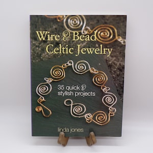 May include: A set of three ceramic mugs with a speckled, matte finish. The mugs are in shades of cream, light gray, and dark gray. Each mug has a simple, minimalist design, perfect for coffee or tea.